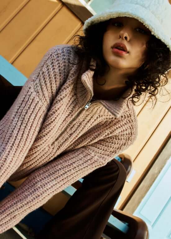 Model wearing Garage sweaters.